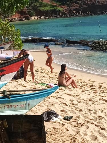 a group of people playing on the beach at Praneeth Guest House in Mirissa