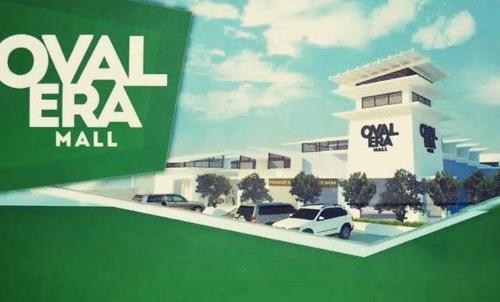 a rendering of a mall with cars in a parking lot at Oval era mall hotel condo suites in Bangued