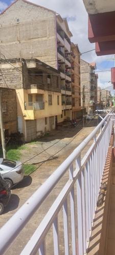 a view of a building from a balcony at Apartment behind Capricorn pub in Thika