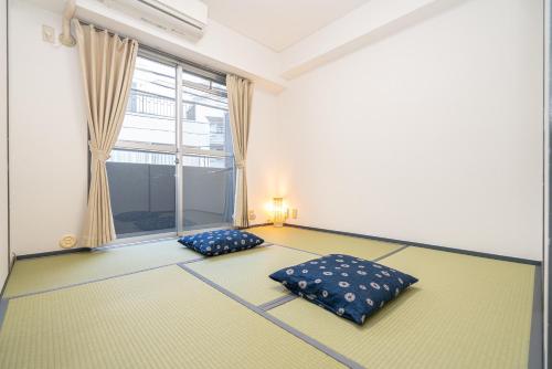 Postel nebo postele na pokoji v ubytování Two-bedroom, 6-minute walk to the Yamanote Line