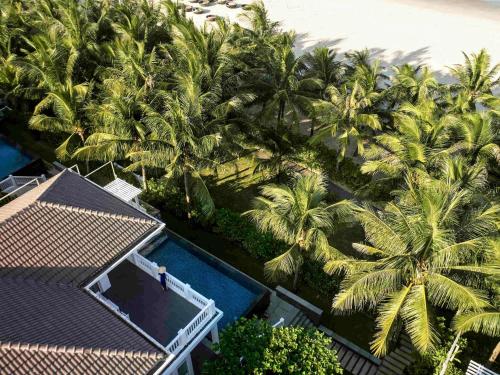 an overhead view of a resort with palm trees at Premier Village Danang Resort Managed By Accor in Danang