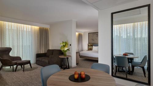a rendering of a hotel room with a bedroom at Doubletree By Hilton Hull in Hull