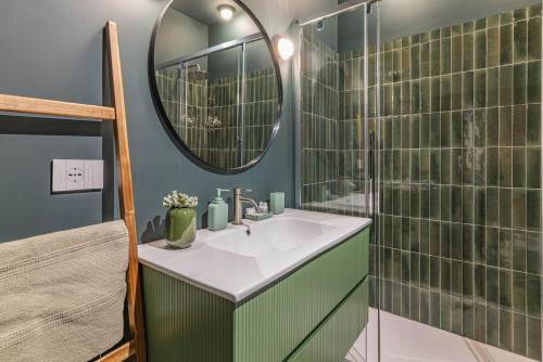 a bathroom with a sink and a mirror at Luxury apartment - Free Parking - Duomo-Navigli in Milan