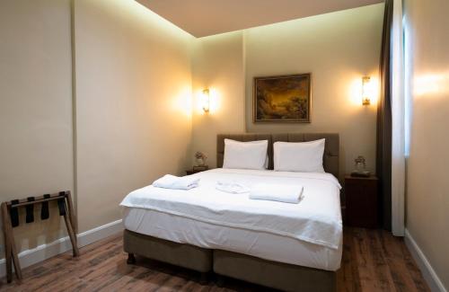 Ένα ή περισσότερα κρεβάτια σε δωμάτιο στο Level Suites - 203