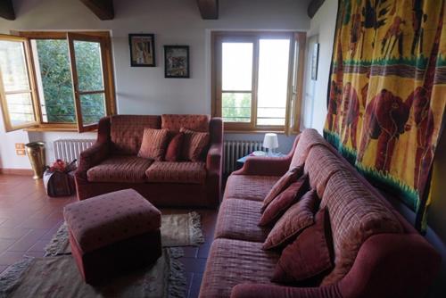 a living room with two couches and a couch at Casa Tre Pini in Serravalle Pistoiese