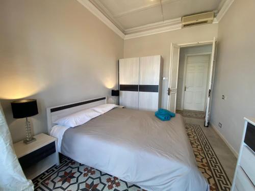a bedroom with a large white bed in a room at SeaView Valletta Apartment in Valletta