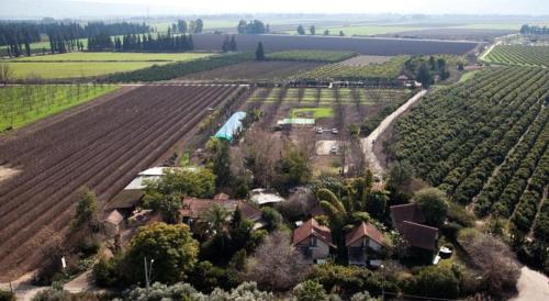 an aerial view of a house in a vineyard at Vitrage Holiday Village and Spa in Bet Hillel