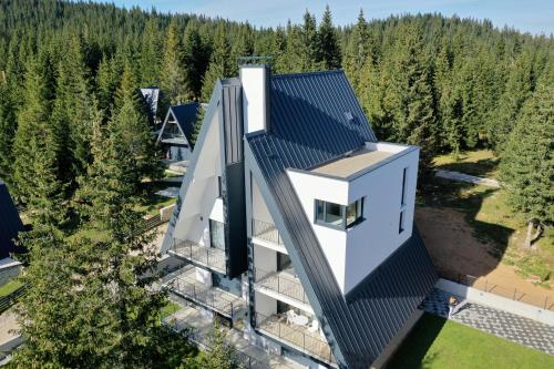 an aerial view of a house in the woods at GO Jahorina by Olympic Gardens in Jahorina