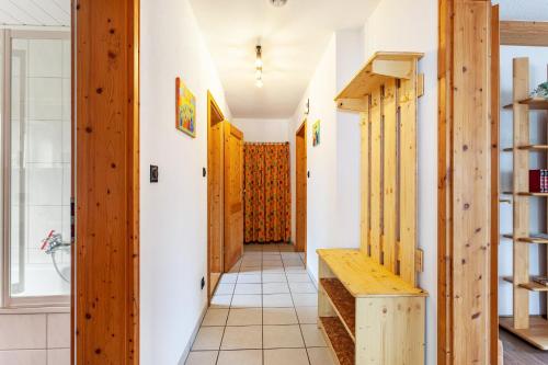a hallway in a house with wooden walls and a staircase at Ferienwohnung Busch in Meinerzhagen