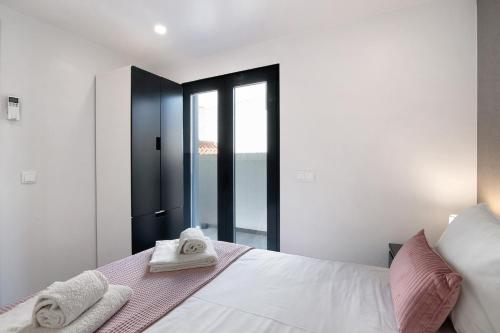 Ένα ή περισσότερα κρεβάτια σε δωμάτιο στο Be Glow Home
