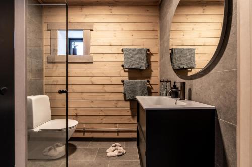 a bathroom with a sink and a mirror at Villa Hjelmbacken in Idre