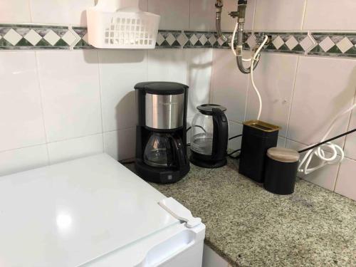 a coffee maker on a counter in a kitchen at Casa Vincent, 350 m tot strand, airco in Villajoyosa