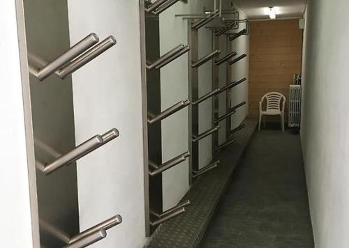 a hallway with a row of lockers in a room at Chalet Girasole in Livigno