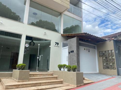 a building with stairs and a number on it at Hotel APART Zuccolotto 101 in Aracruz
