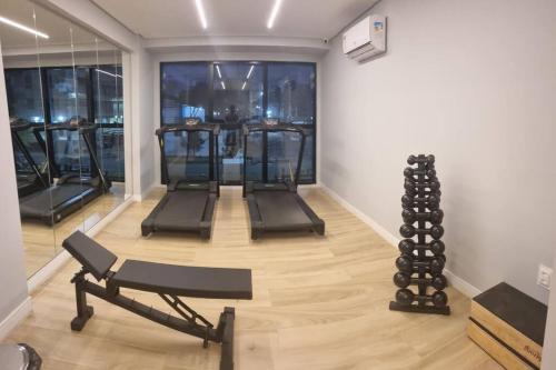 a room with a gym with exercise equipment in it at Excelente Flat beira-mar in Cabedelo