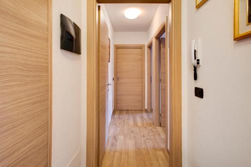 a hallway of a house with wooden floors at Le Sorgenti - Piano terra in Valdisotto