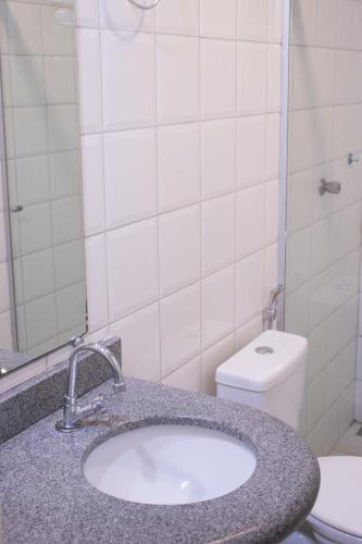 a bathroom with a sink and a toilet at Lago Da Palma in Palmas