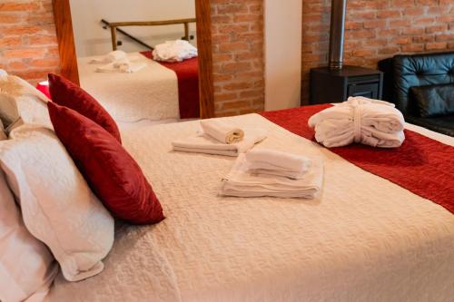 a hotel room with two towels on a bed at Espaço Viverde Penedo in Penedo