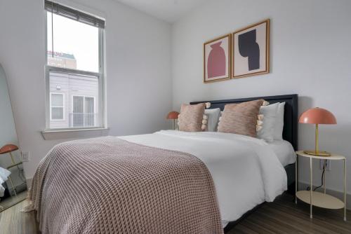 a bedroom with a large white bed with a window at Downtown 1br w deck gym nr Congress Ave ATX-216 in Austin