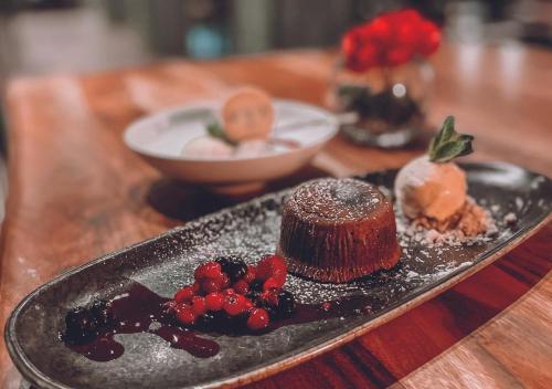 a plate with a chocolate dessert on a table at Hit the Sky in Sankt Christoph am Arlberg