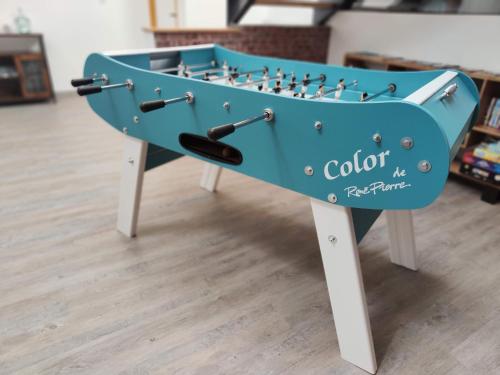 a blue foosball table with the words color me resilient at Ô Loft - 3 chambres avec 3 salles de bains - parking - climatisation in Albi