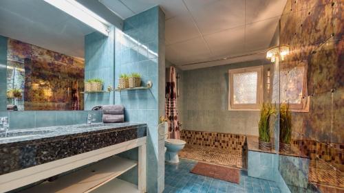 a bathroom with a sink and a toilet at Costacabana - Villa Roxy in Lloret de Mar