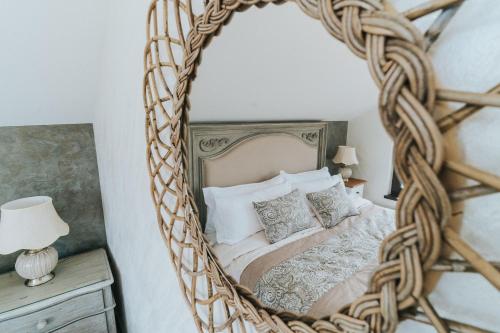 a bedroom with a bed with a large mirror at Diplomat Villa in Baile Felix