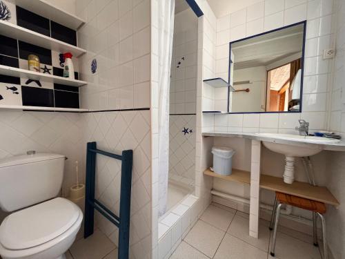 a bathroom with a toilet and a sink at Maison avec cour, à 25m de la plage, proche centre et commerces - FR-1-197-573 in Les Sables-dʼOlonne