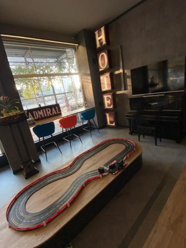 a large race car on a table in a room at Admiral Hotel in Milan