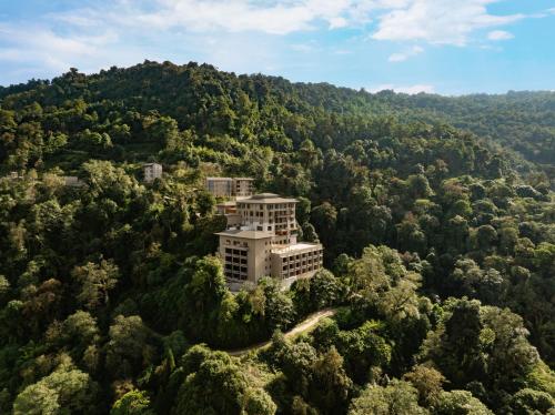 an aerial view of a building in the middle of a forest at Taj Guras Kutir Resort & Spa, Gangtok in Gangtok