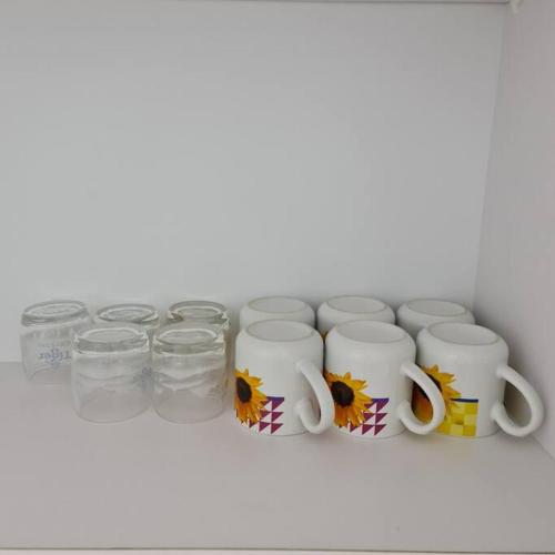 a shelf with a bunch of cups and glasses at THE COVE at D'Garden City Centre in Batu Pahat