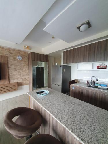 a kitchen with a counter and a sink and a counter top at Amaia Steps Capitol Central N814 in Bacolod