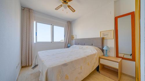 Ένα ή περισσότερα κρεβάτια σε δωμάτιο στο Agua Viva Apartamento con 2 dormitorios
