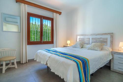 En eller flere senge i et værelse på G403 Gran Canal by Mallorca Villa Selection