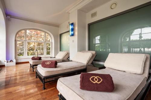 a room with two beds with olympics signs on them at Sofitel Grand Sopot in Sopot