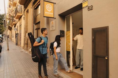 a group of people standing outside of a store at Onefam Paralelo in Barcelona