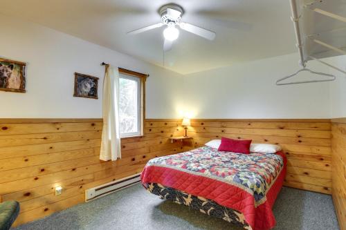 a bedroom with a bed and a ceiling fan at Lakefront Bemidji Getaway with Community Beach! in Bemidji