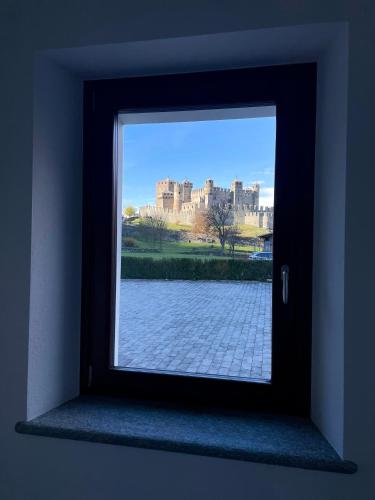 a window with a view of a castle at À la Bouteucca in Fenis