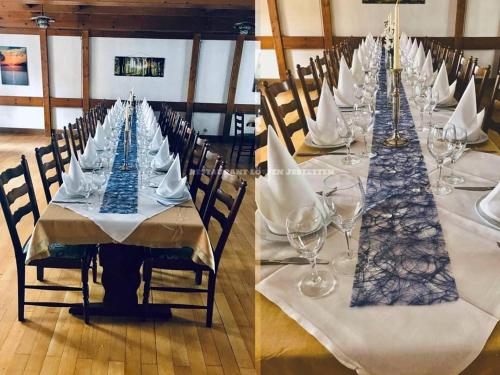 a long table with wine glasses and napkins on it at Hotel-Restaurant Zum Loewen in Jestetten