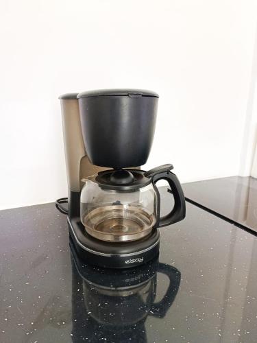 a coffee pot sitting on top of a counter at La belle Martinique in Sainte-Luce