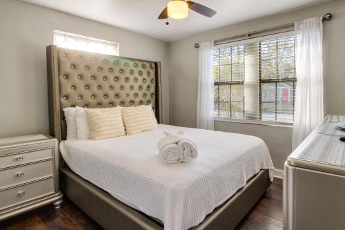 a bedroom with a bed with a large headboard at Savannah Home with Yard about 3 Mi to Downtown! in Savannah