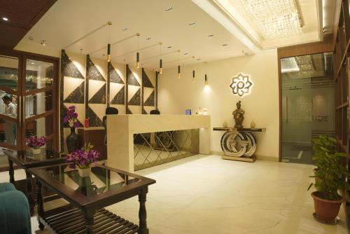 a store lobby with a table and a mirror at The Pride in Jamshedpur