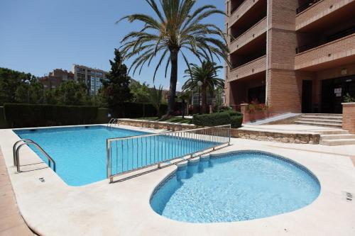 The swimming pool at or close to Apartamentos La Caseta - SABESA