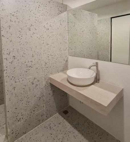 a white bathroom with a sink and a mirror at Number3 Poolvilla Bangkok in Lat Krabang