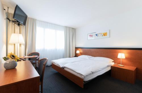 Postel nebo postele na pokoji v ubytování Motel Gottardo Sud