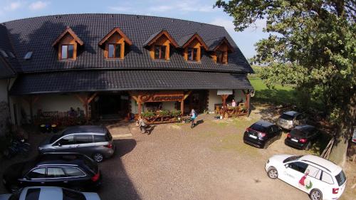 a large house with cars parked in front of it at Dwa Dęby in Lubawka