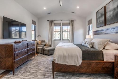 a bedroom with a large bed and a dresser at Creekhouse 1380 in Mammoth Lakes