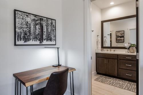 a home office with a desk and a mirror at Creekhouse 1380 in Mammoth Lakes