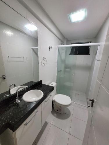 a bathroom with a shower and a toilet and a sink at Apartamento Summer Beach Bombas in Bombas