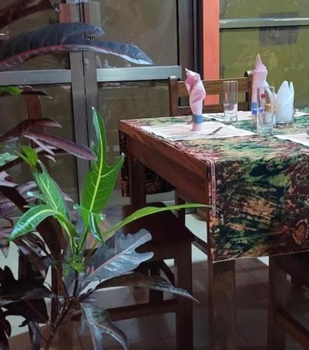 a wooden table with a box on top of it at Great Heights Motel in Entebbe